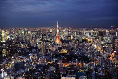 High angle view of illuminated city buildings at night