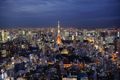 Aerial view of illuminated city buildings at night