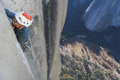 Rock climber crack climbing on the nose, el capitan in yosemite