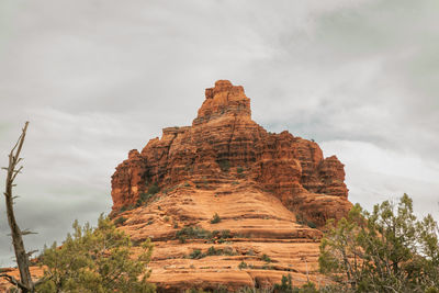Low angle view of bell rock sedona against sky