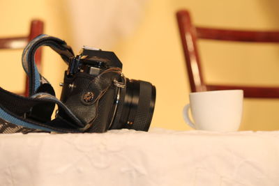 Close-up of camera on table