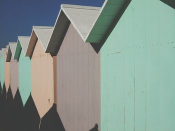 Beach huts on sunny day