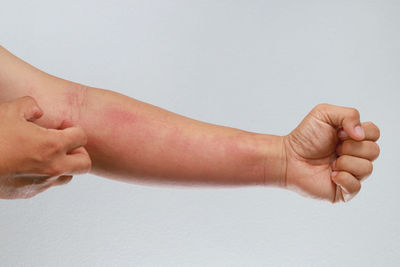 Low section of person against white background