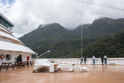 Chairs and tables at restaurant against sky