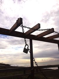 Low angle view of silhouette bridge against sky