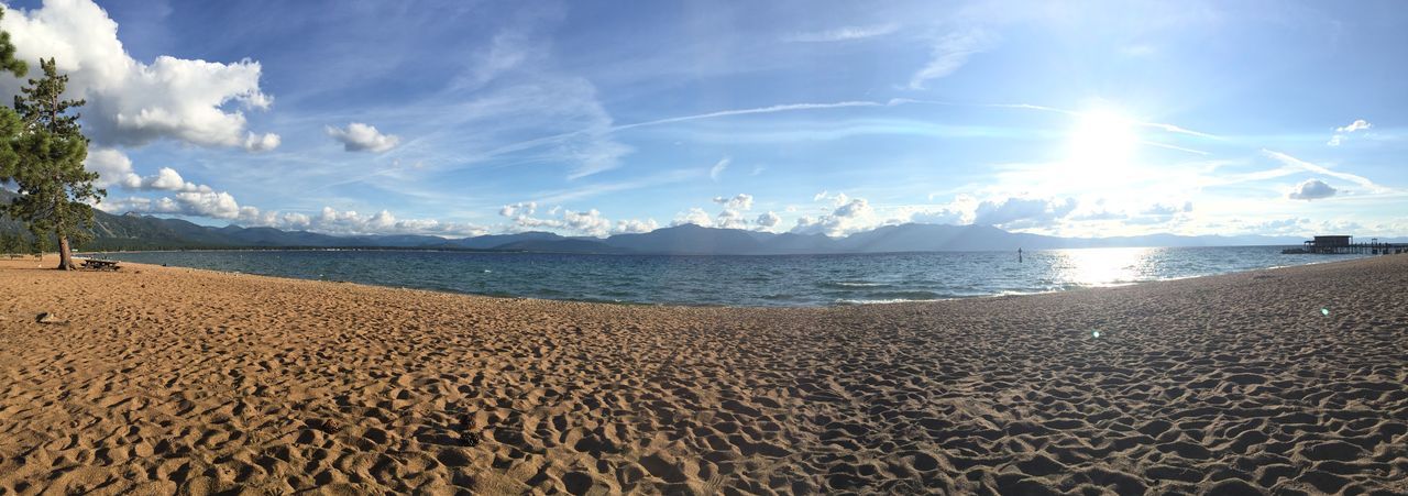 beach, sand, sky, water, sea, shore, tranquil scene, tranquility, scenics, beauty in nature, nature, sunlight, cloud - sky, horizon over water, panoramic, cloud, idyllic, incidental people, day, blue