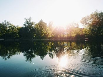 Sun shining over lake