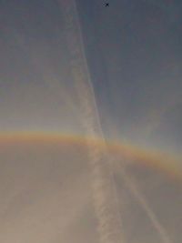 Low angle view of rainbow against sky