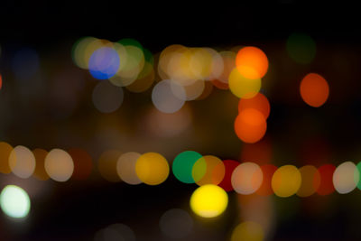 Defocused image of illuminated lights at night