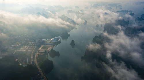 Aerial view of clouds over sea and land