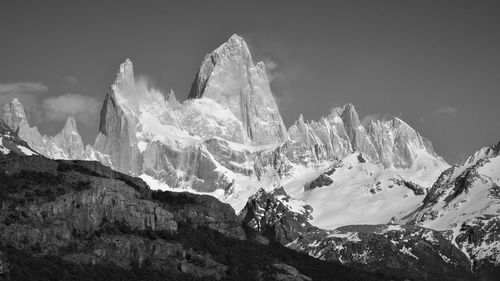 Scenic view of snowcapped mountains against sky