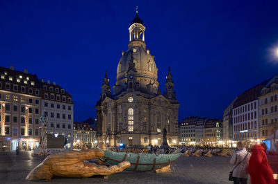 Illuminated buildings in city at night