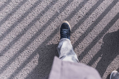 Low section of person on sand