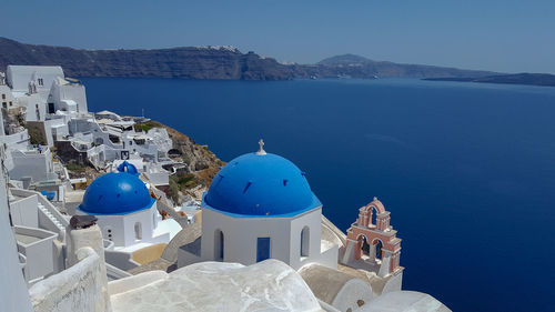 Panoramic view of sea and buildings against sky