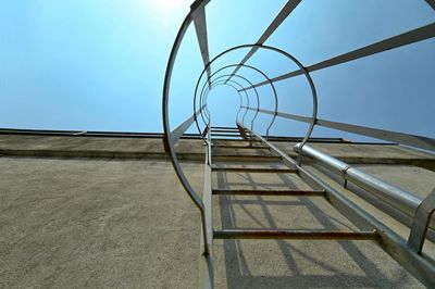 Low angle view of spiral staircase against sky