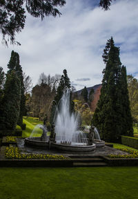 Fountain in park against sky