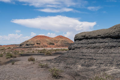 Bisti badlands in new mexico landscape of black and orange barren hillsides