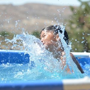 Boy swimming in pool