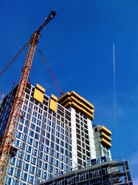 Low angle view of building against blue sky