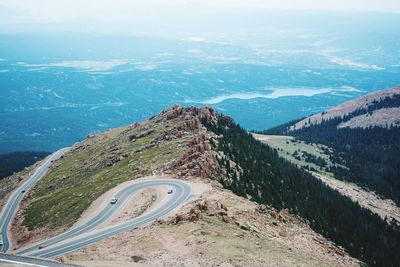 Aerial view of road passing through mountain