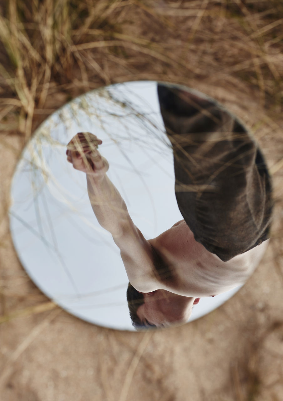 one person, real people, adult, high angle view, lifestyles, human body part, women, day, leisure activity, barefoot, body part, nature, men, outdoors, hand, human hand, focus on foreground, directly above, human foot