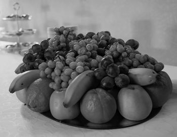 Close-up of grapes in container on table