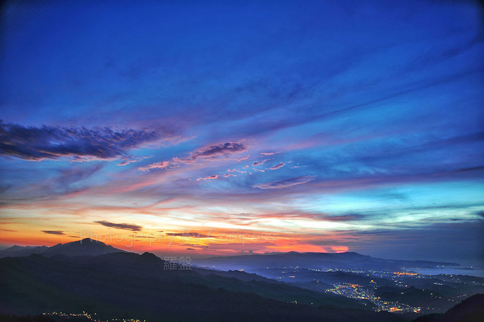 SCENIC VIEW OF SUNSET OVER MOUNTAINS