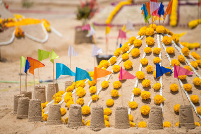 Sandcastles at temple during sunny day