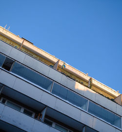 Low angle view of building against clear blue sky