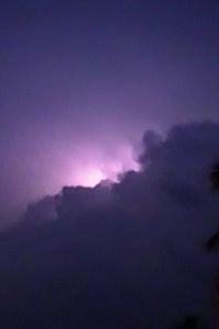 Low angle view of dramatic sky at night