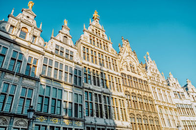 Low angle view of building against blue sky