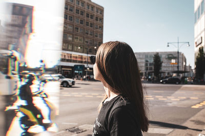 Side view of woman on city street