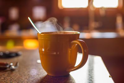 Close-up of coffee cup on table