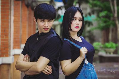 Young couple standing outdoors