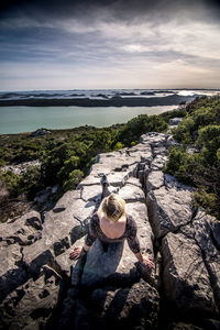 High angle view of rocks on beach against sky