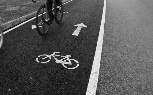 High angle view of bicycle sign on road