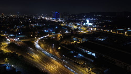 High angle view of illuminated cityscape at night