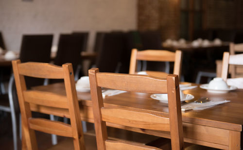 Empty chairs at restaurant