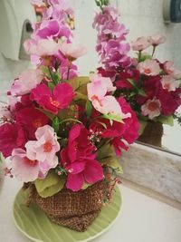 Close-up of pink flowers in vase on table