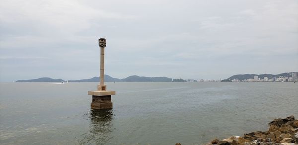 Scenic view of bay against sky