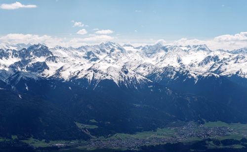 Scenic view of snowcapped mountains against sky