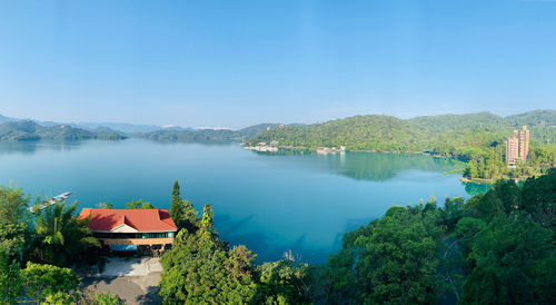 Scenic view of lake against blue sky