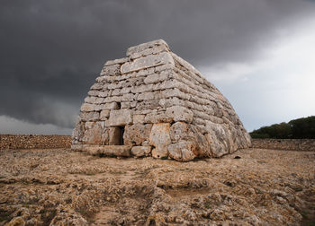 Rock formation on land against sky