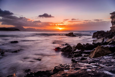 Scenic view of sea against sky during sunset
