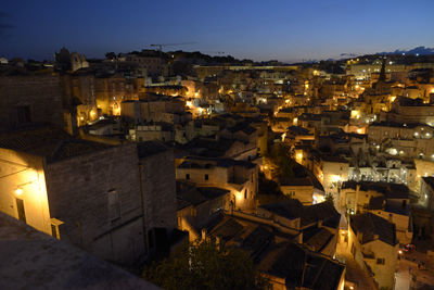 High angle view of illuminated buildings in city at night