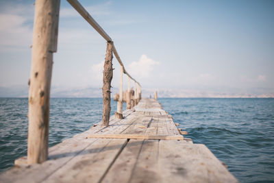 Pier over sea against sky