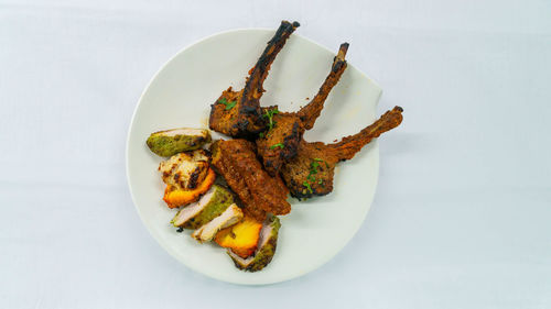 High angle view of meat in plate on table