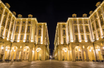 Illuminated buildings in city at night