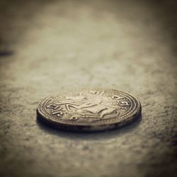 Close-up of coin on wall
