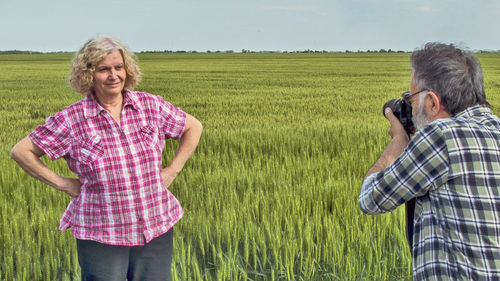 Friends standing on field